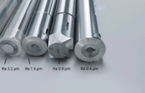 CNC machined parts showing_different_surface_finishes with Ra value labels