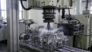 Professional Shenzhen factory photo showing a 5-axis CNC milling center machining a complex titanium medical implant component, with visible high-pressure coolant, precise tool engagement, and clean chip evacuation