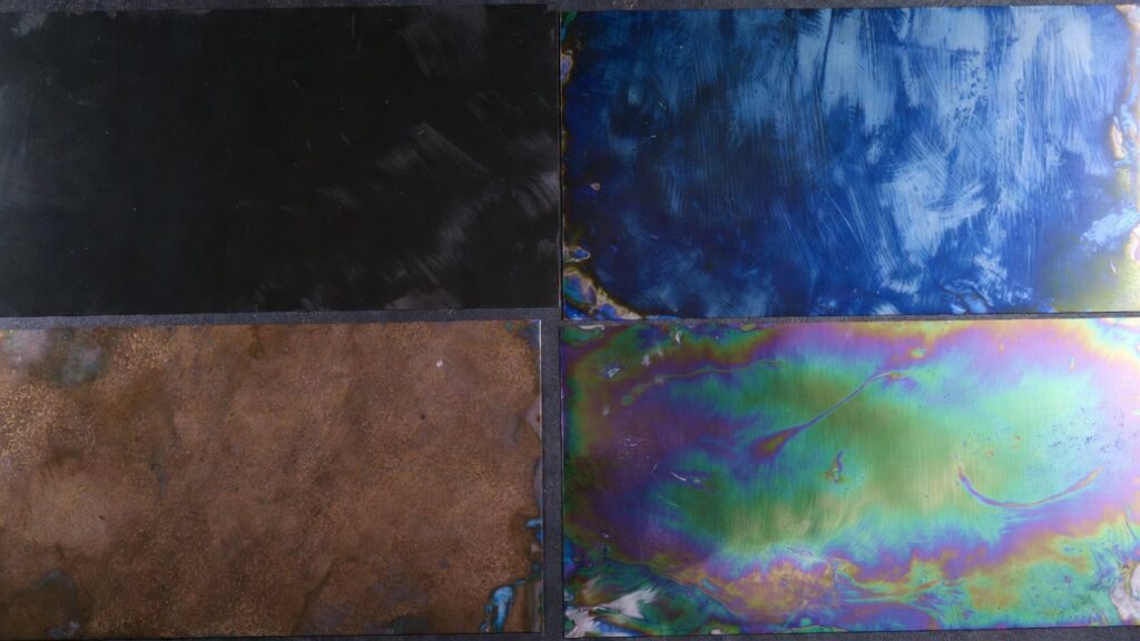 Color annealing examples on stainless steel showing black, blue, brown, and multi-color marks